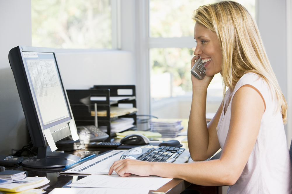 remote employee = woman on phone getting coaching