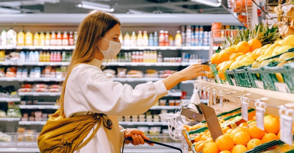 woman wearing mask while shopping