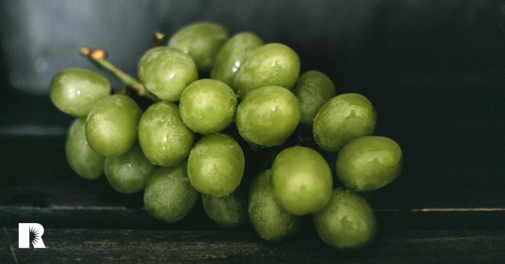 A photo illustration of a clump or grapes, symbolizing a group of similar objects.