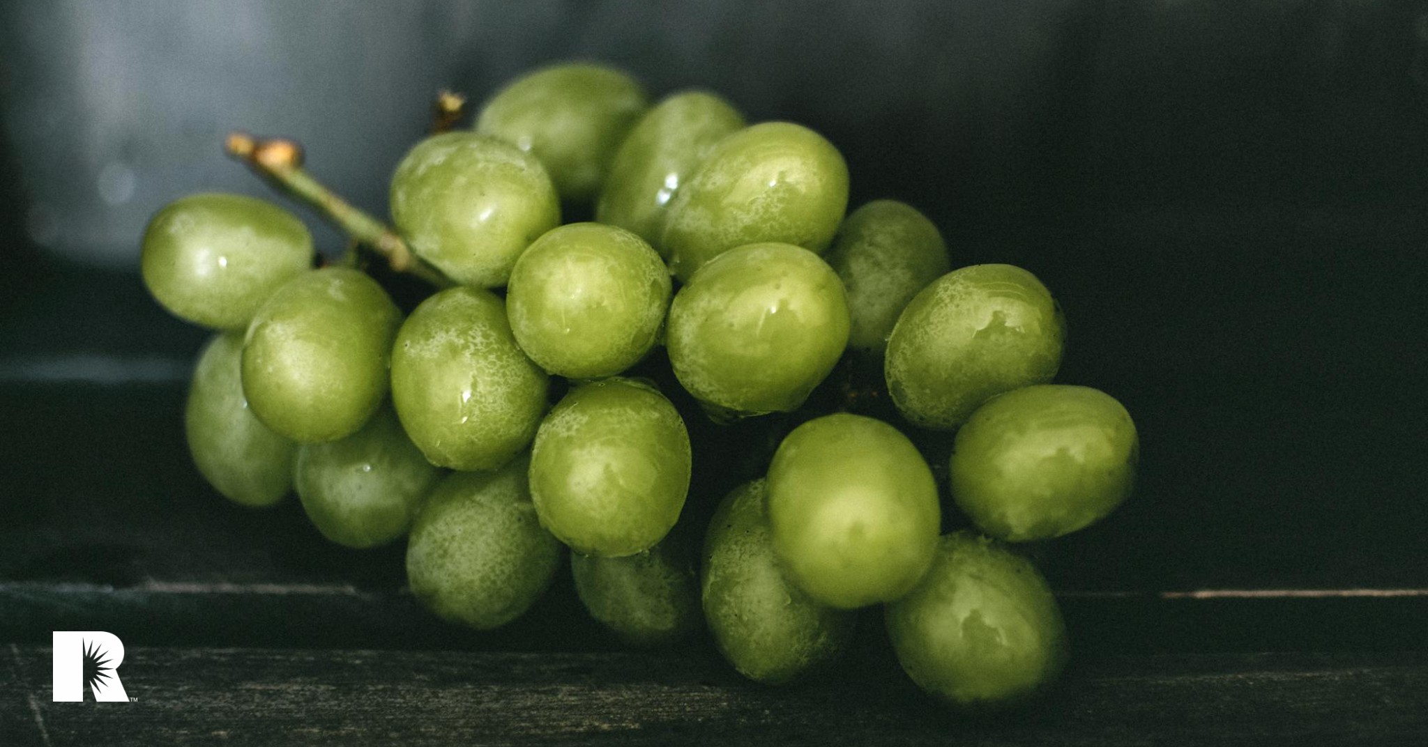 A photo illustration of a clump or grapes, symbolizing a group of similar objects.