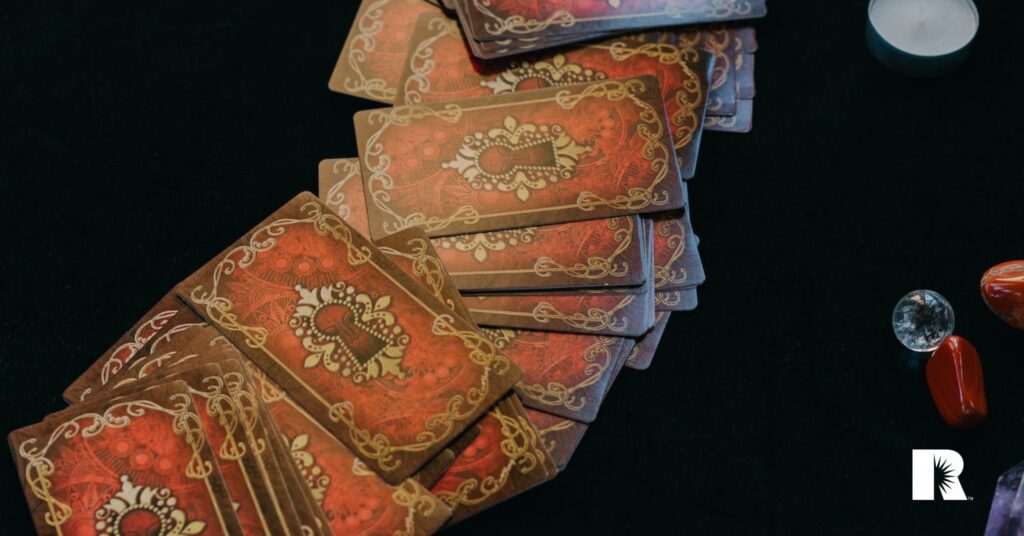 An image of tarot cards spread across the desk of a soothsayer.