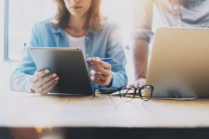 Woman using a tablet for business