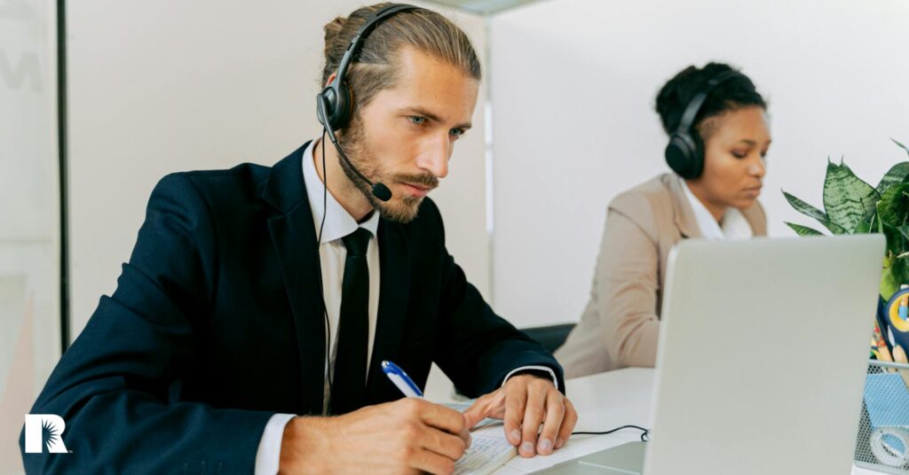 Insurance agency staffers attempt to serve their clients over the phone.