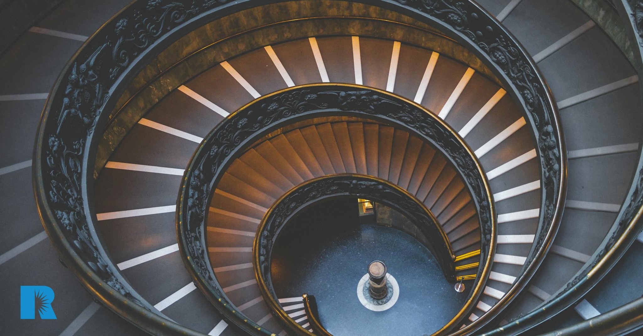 A photo showing three flights of a spiral staircase.