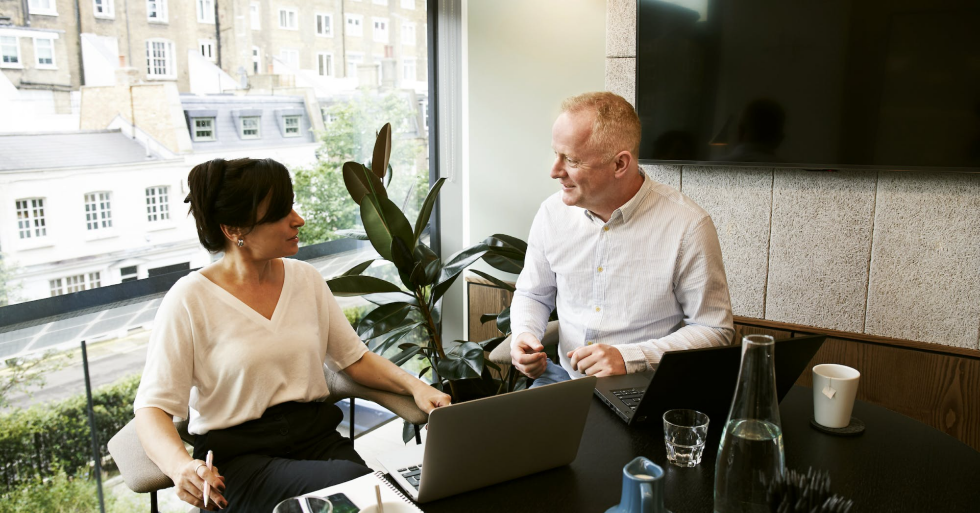 An insurance agent discussing a policy with a client