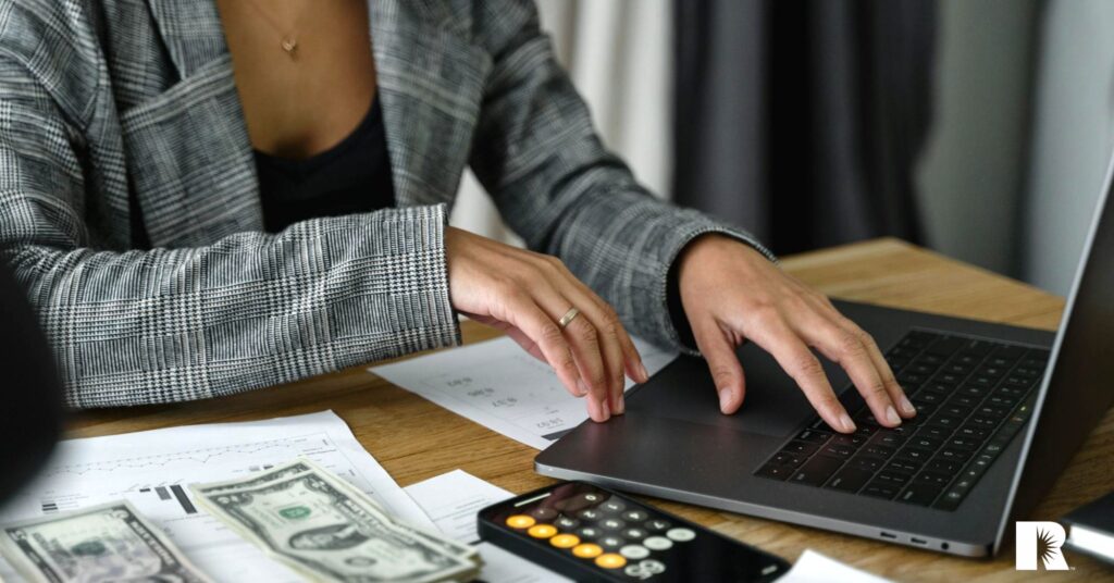 An insurance agent reviews her monthly profit statements.