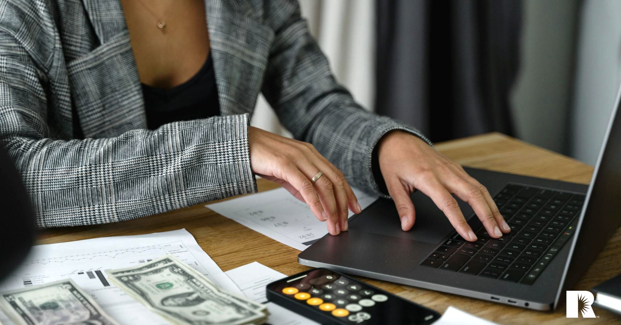 An insurance agent reviews her monthly profit statements.