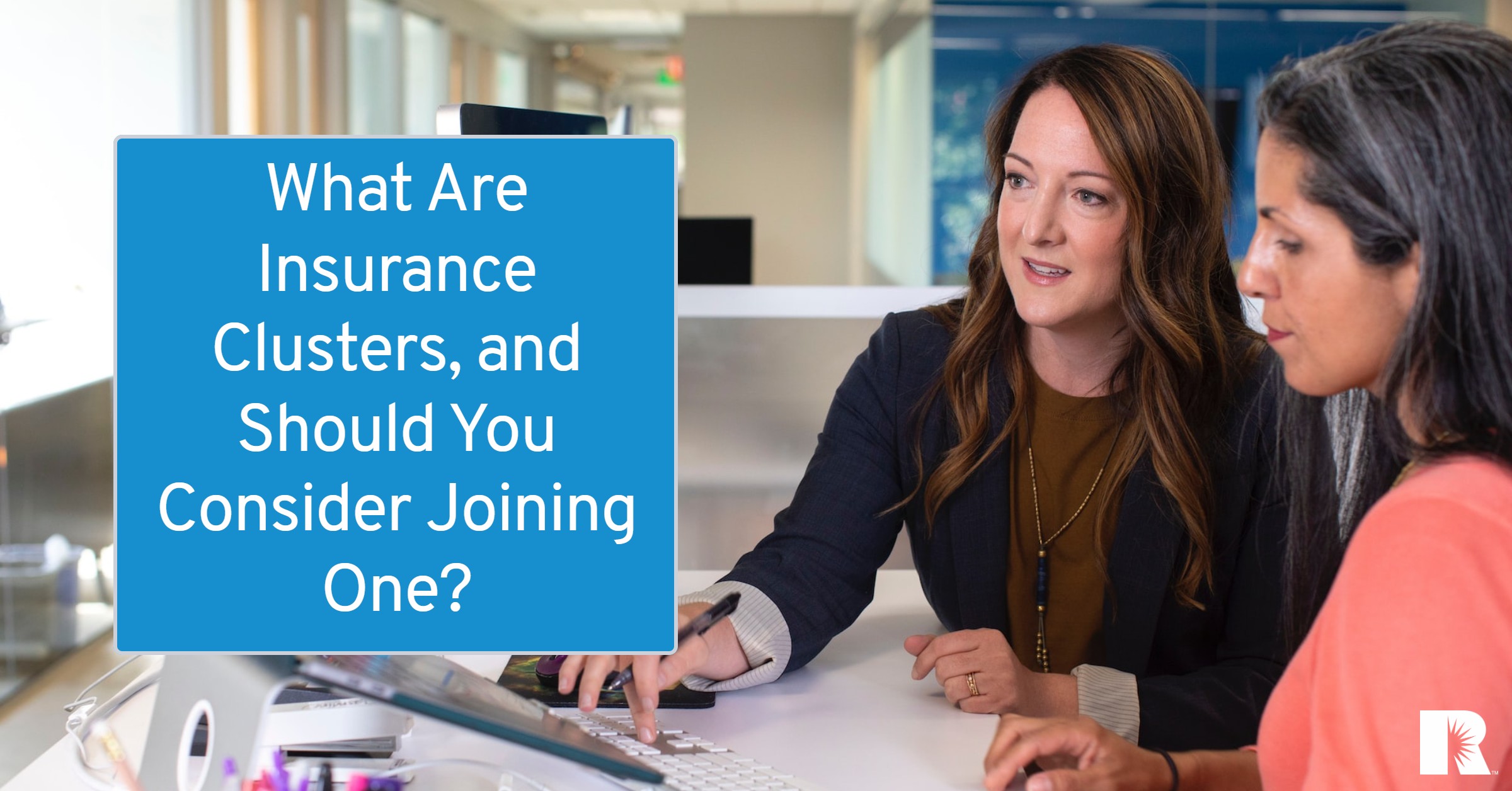 An insurance agent advises a client on risk management.