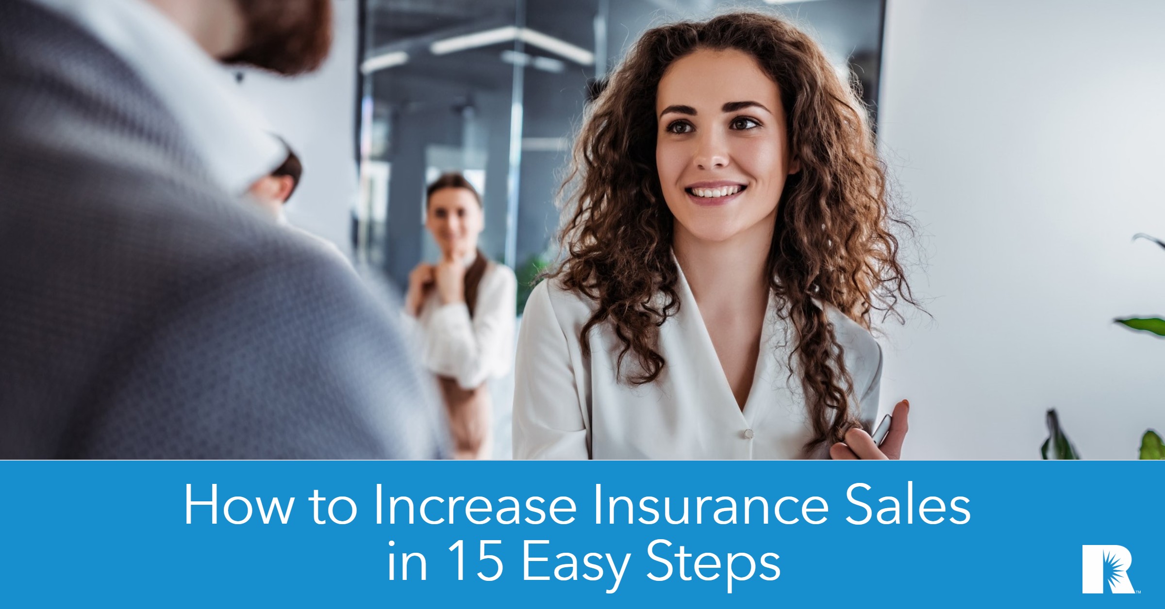 An insurance agent greets a client for a meeting.