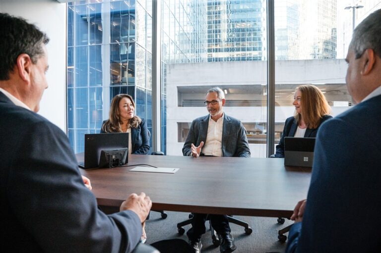 Insurance professionals in a conference room.