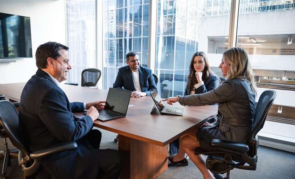 Insurance professionals in a conference room.