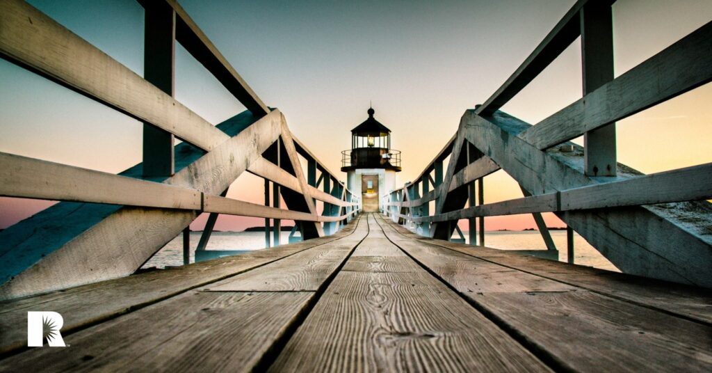 An image of the Marshall Point Lighthouse in Maine, at dusk.