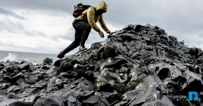 Photo illustration of a man navigating treacherous terrain.