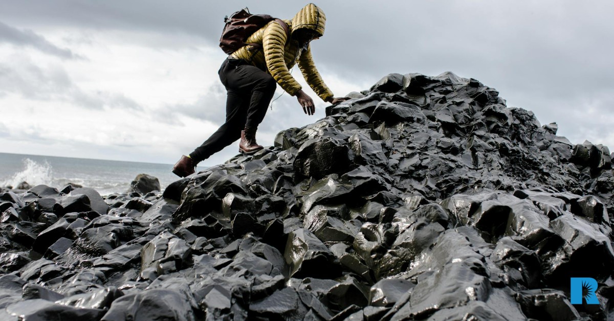 Photo illustration of a man navigating treacherous terrain.