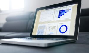 An open Macbook, showing software used for business.
